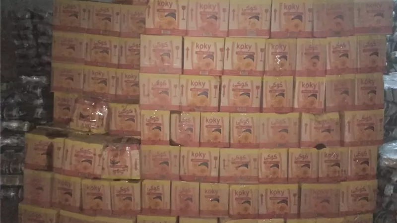 ضبط 8676 زجاجة زيت تمويني و200 كرتونة مياه غازية داخل مصنع في البحيرة